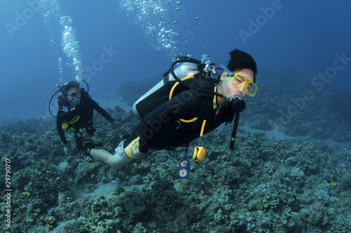 Asian scuba divers having fun
