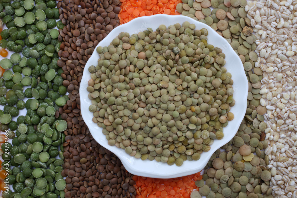 Ceramic plate with lentils over seeds and grains background Ceramic plate with lentils over seeds and grains background