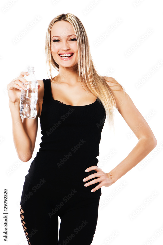 Cheerful beautiful woman with a bottle of fresh water