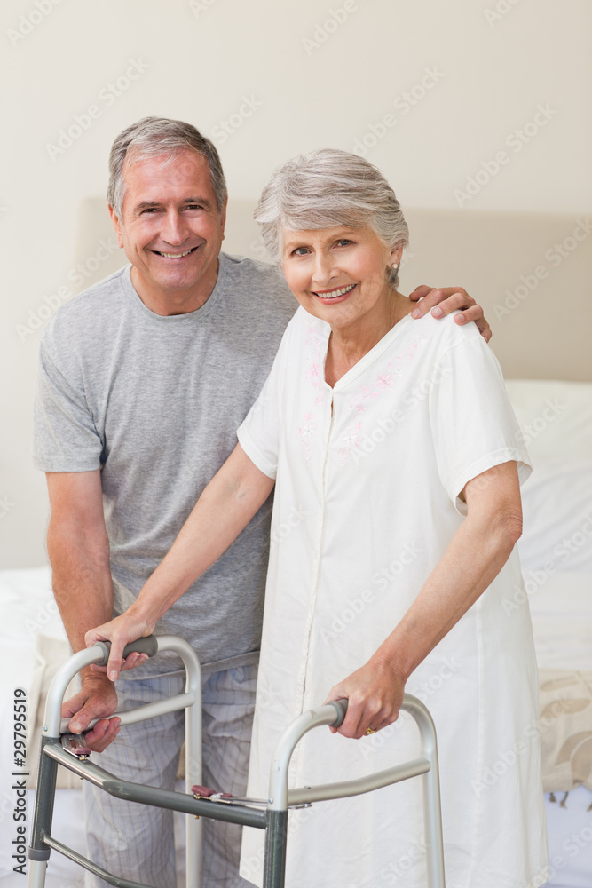 Fototapeta premium Man helping his wife to walk