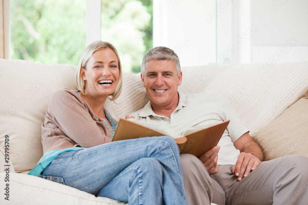 Couple looking at their photo album