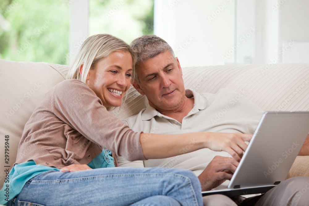 Couple looking at their laptop Couple looking at their laptop