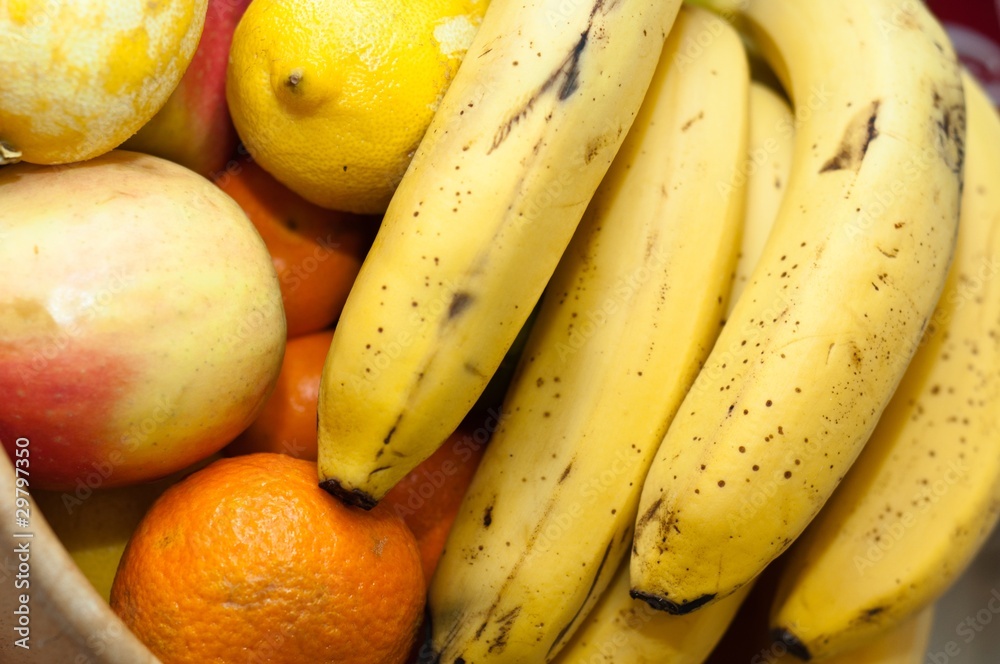 orange, banana, and otherfresh fruits in wooden dish orange, banana, and otherfresh fruits in wooden dish