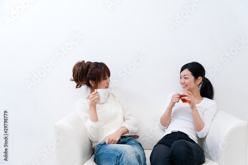 beutiful asian women relaxing on the sofa