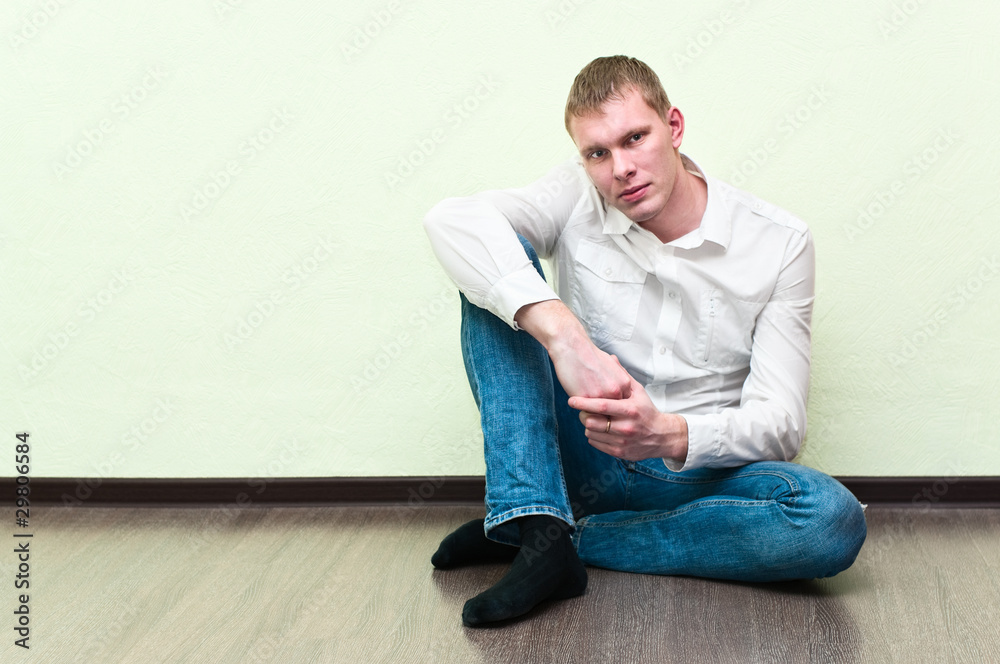 Handsome man in the new empty apartment Handsome man in the new empty apartment