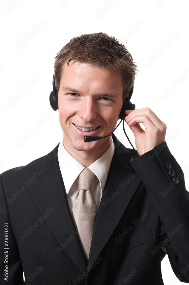 young smiling businessman talking with headset young smiling businessman talking with headset