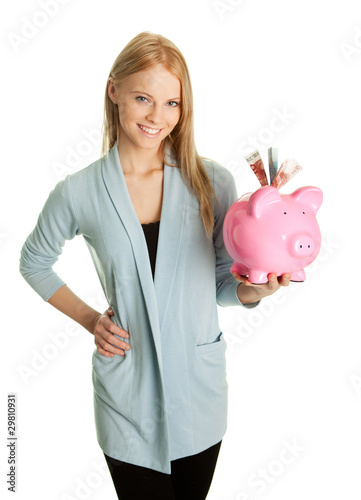 Beautiful young woman saving money