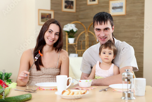 young family at home having meal