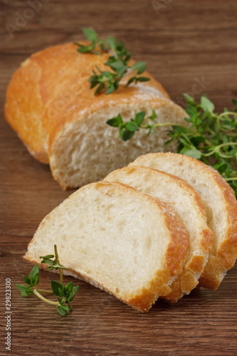 Tasty French baguet with a fresh thyme.
