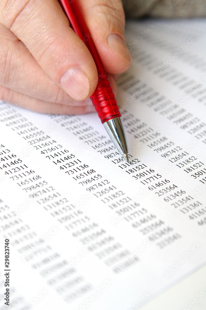 Male hand and business document lying on the table Male hand and business document lying on the table