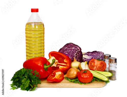 Fototapeta Naklejka Na Ścianę i Meble -  sunflower seed oil and vegetables for preparation of salad
