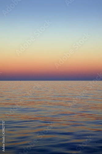 Beautiful sunset sunrise over blue sea ocean red  sky