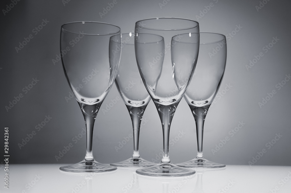 Four Empty Wine Glasses On White Background In Studio Four Empty Wine Glasses On White Background In Studio