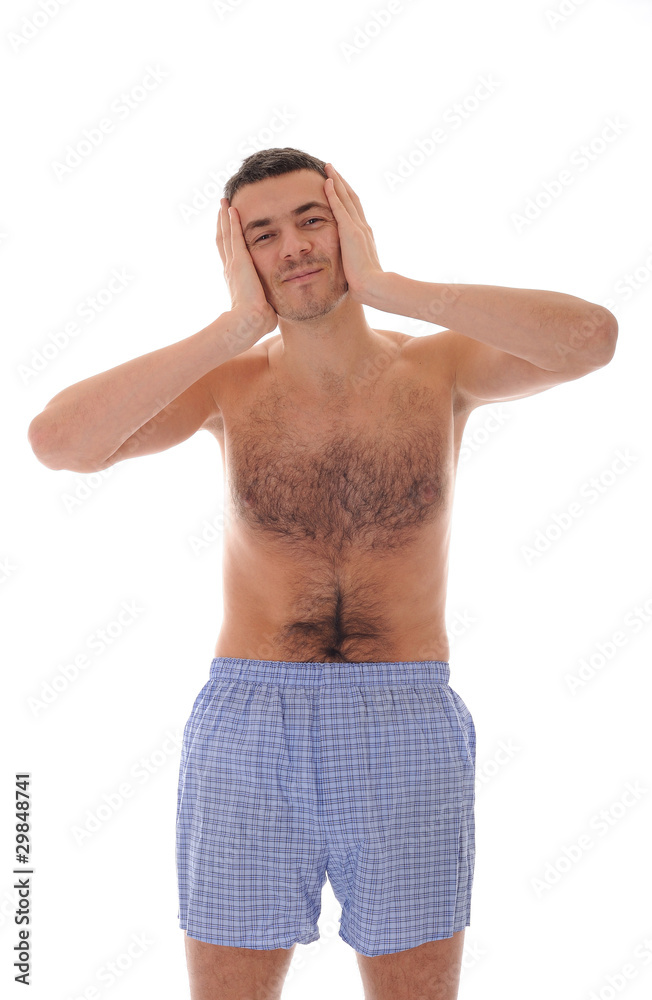 Young handsome man in underware waking up in the morning and yaw Young handsome man in underware waking up in the morning and yaw