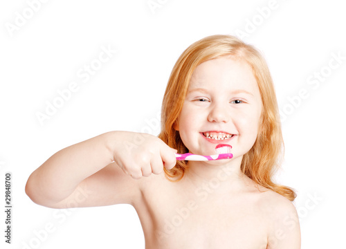 Little girl thinking while washing teeth
