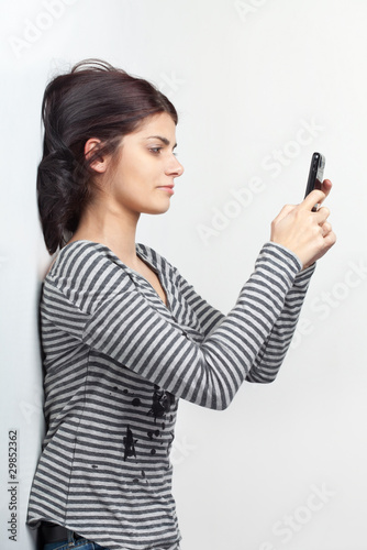 Young woman texting with cellphone