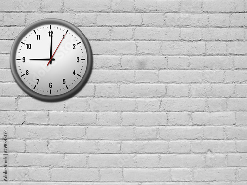 Clock on white brick wall