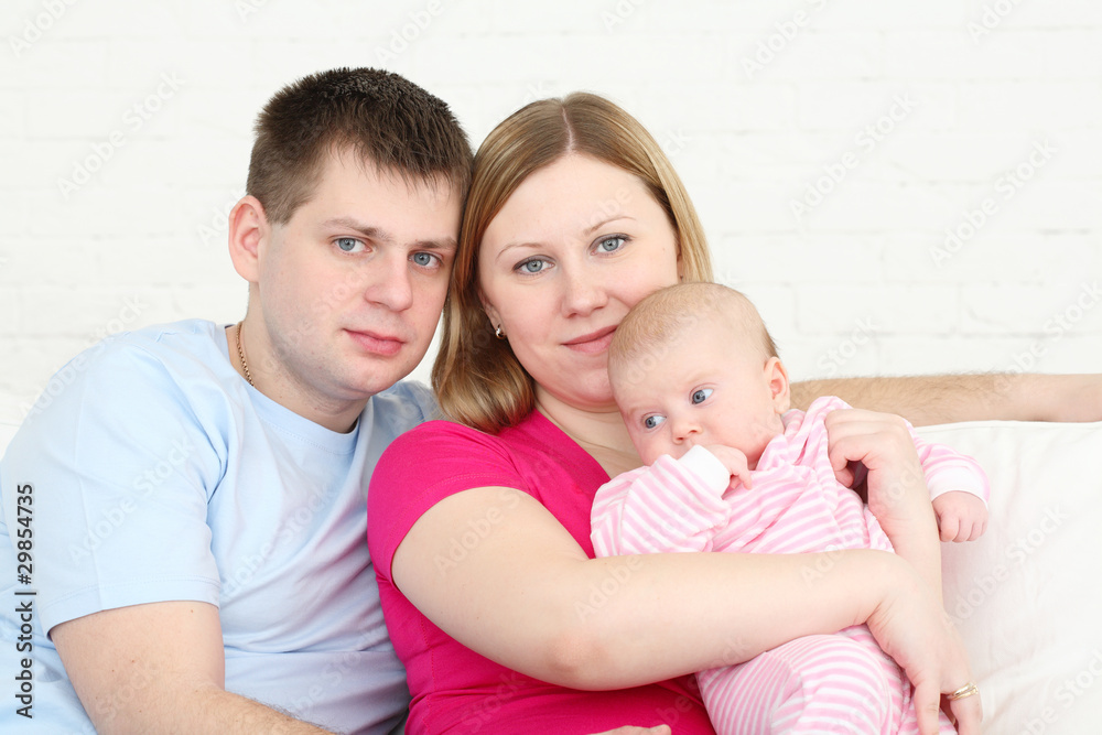 Happy family with the chest baby on hands Happy family with the chest baby on hands