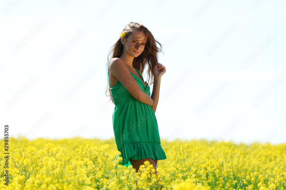 woman on oilseed field woman on oilseed field