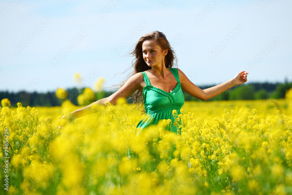 woman on oilseed field woman on oilseed field