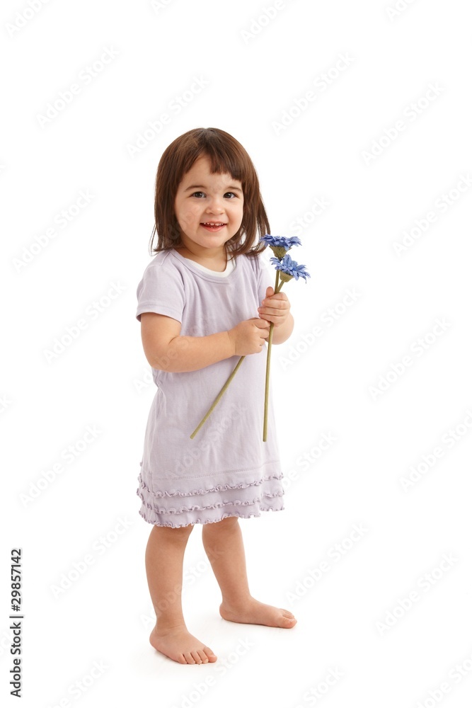 Smiling girl in cute dress with flowers