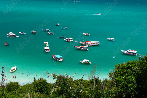 Boats over a crystalline sea in Arraial do Cabo, Brazil