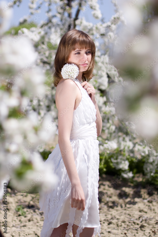 Beautiful girl with spring flower