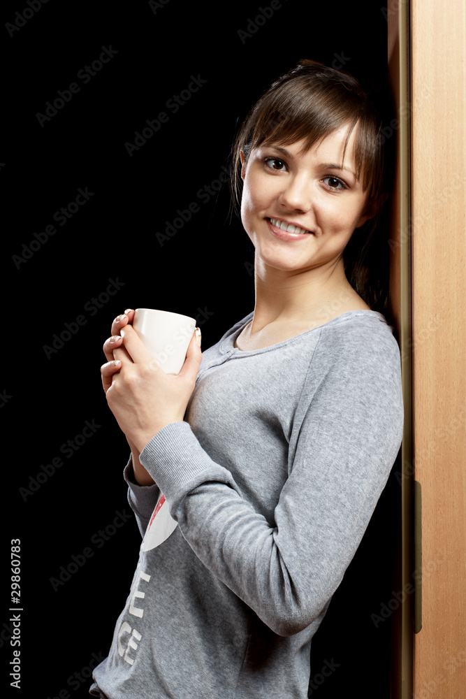 Woman in pajamas leaning the doorway Woman in pajamas leaning the doorway