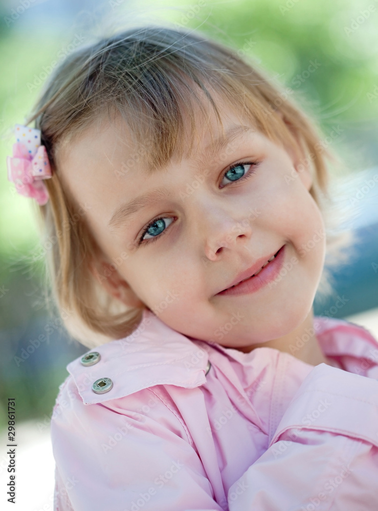beautiful little girl in a pink raincoat beautiful little girl in a pink raincoat