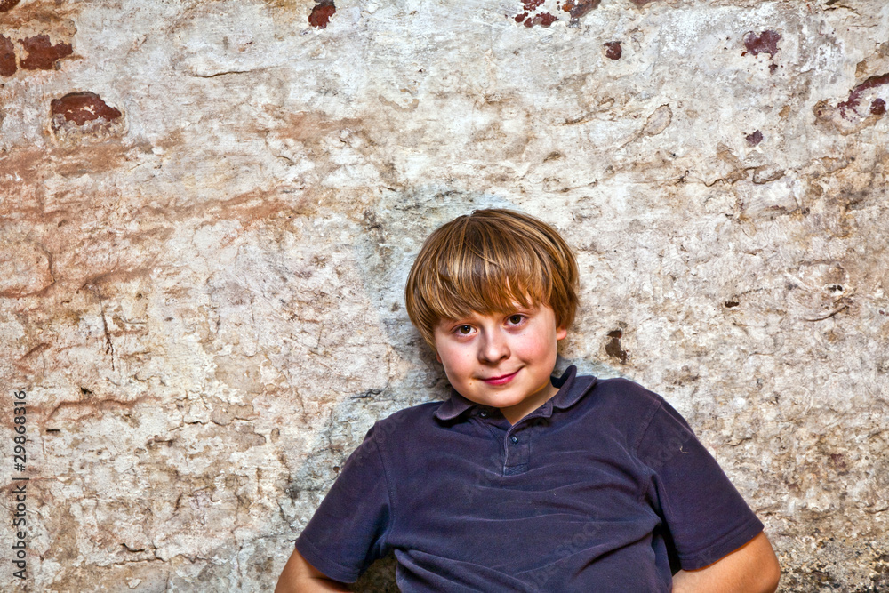 cute boy in the cellar with brick background cute boy in the cellar with brick background