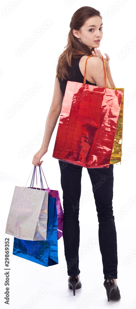 Girl with shopping bags on a white background.