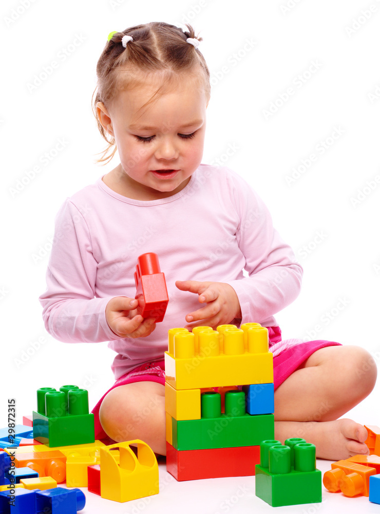 Little girl with building bricks Little girl with building bricks