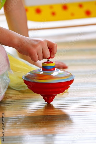 child playing with top