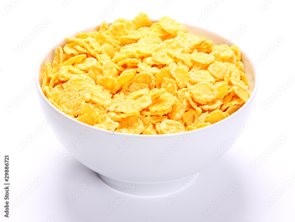 Image of bowl full of cornflakes over white background. Image of bowl full of cornflakes over white background.