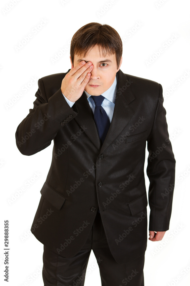 Attentive businessman closed his eyes with his hand Attentive businessman closed his eyes with his hand