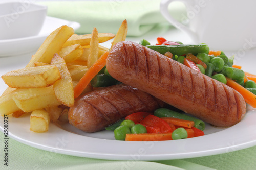 Sausage with french fries and vegetables