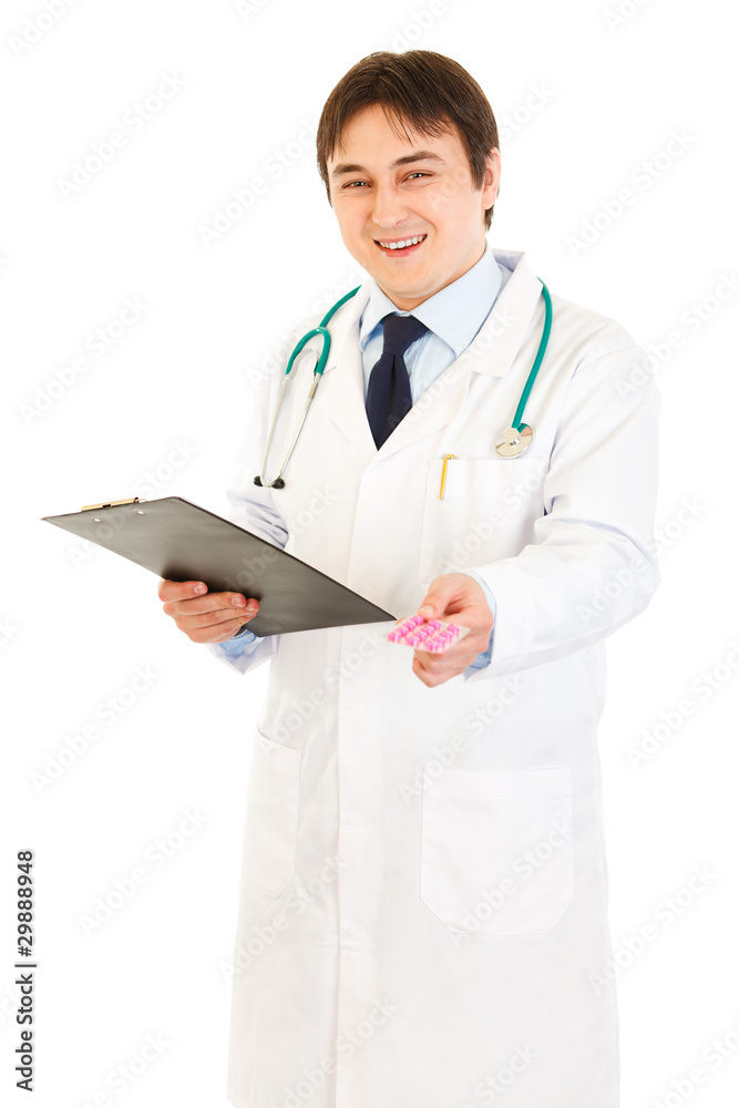 Doctor holding clipboard and prescription drugs in hands