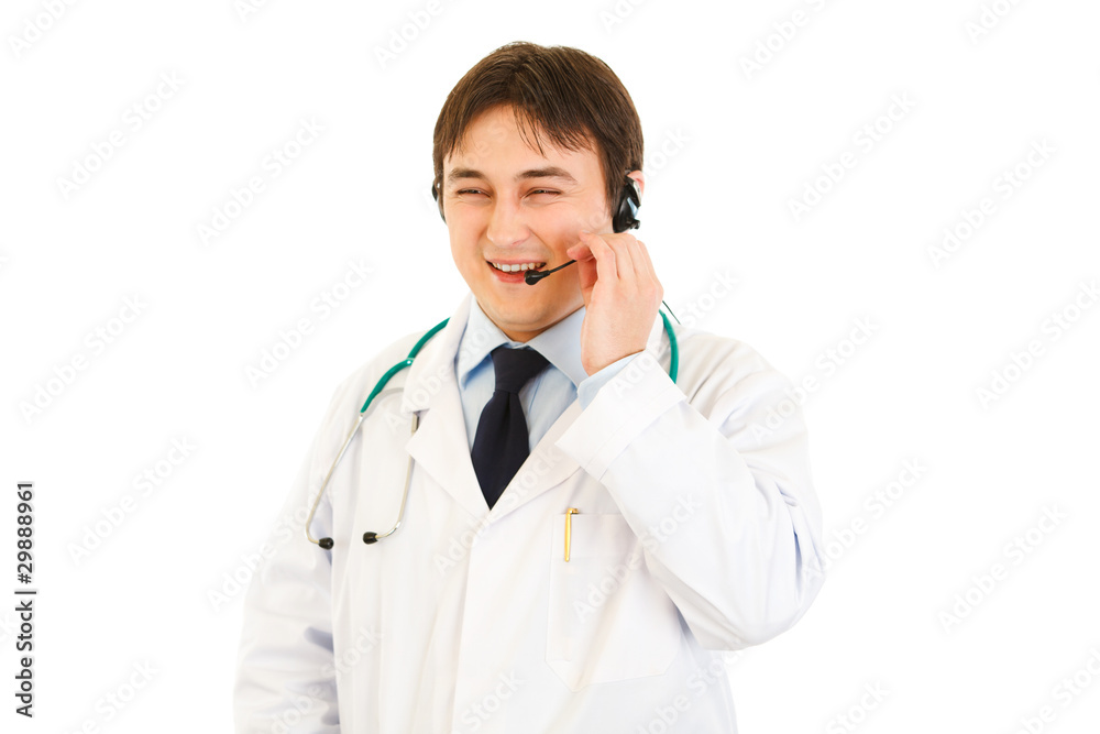 Smiling medical doctor with headset isolated on white. Smiling medical doctor with headset isolated on white.