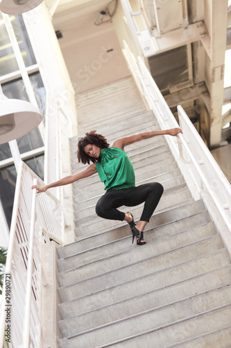 Woman posing on a staircase