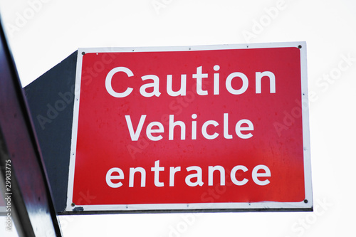 Caution vehicle entrance sign