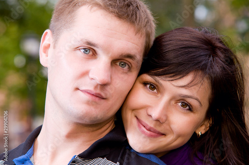 portrait of happy smiling couple looking at camera