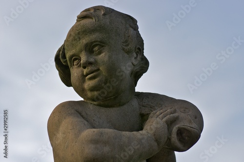 Child with fish, statue in front of Moritzburg Castle