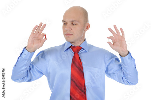 Red and white tablets in male hands