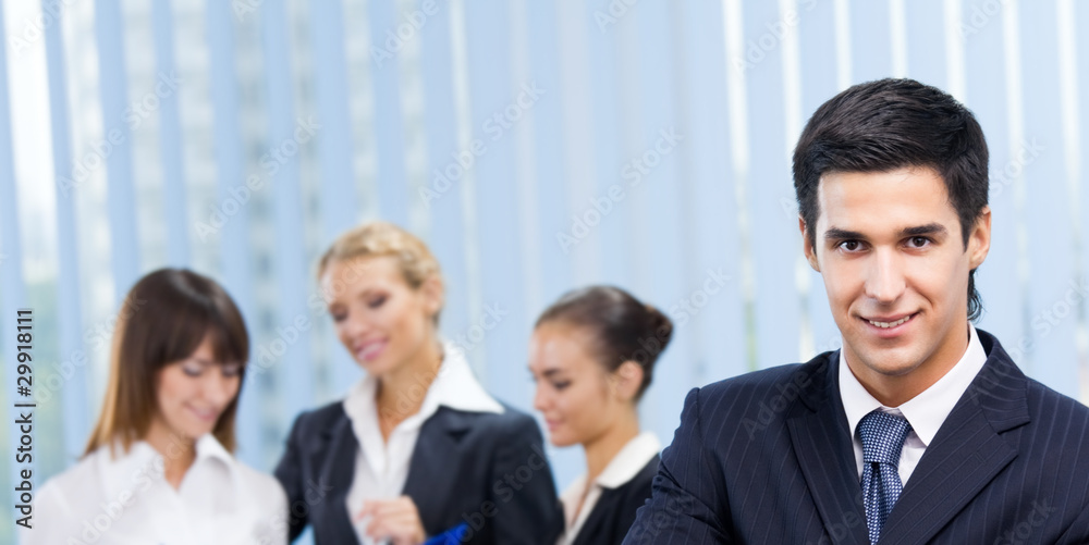 Portrait of happy smiling businessman and colleagues, at office Portrait of happy smiling businessman and colleagues, at office
