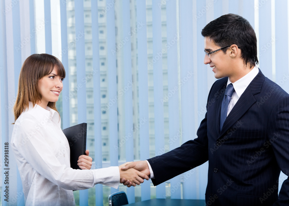 Businesspeople, or businessman and client, with documents Businesspeople, or businessman and client, with documents