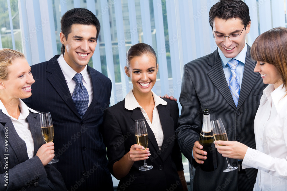 Happy businesspeople celebrating with champagne at office Happy businesspeople celebrating with champagne at office