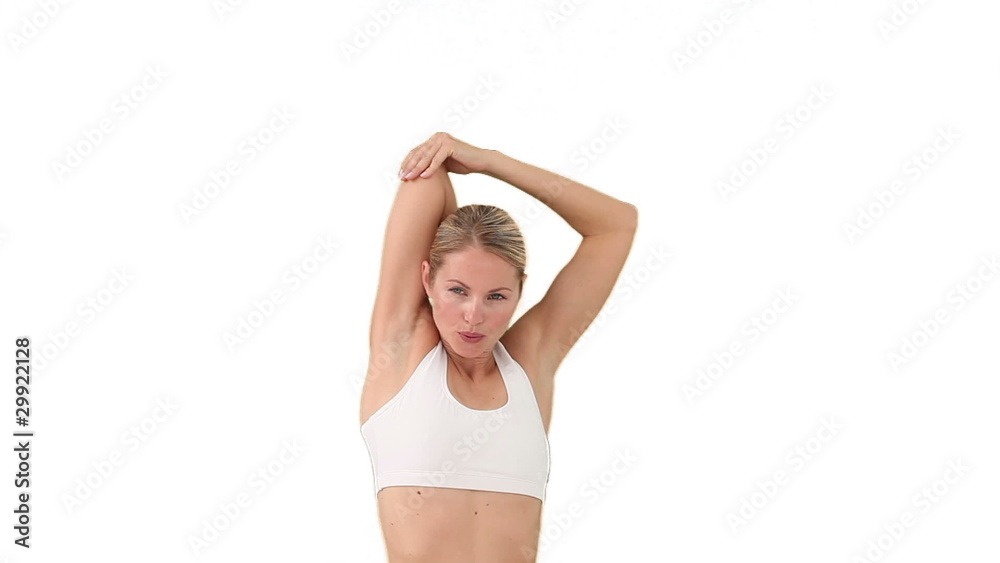Blond woman in sportswear stretching Blond woman in sportswear stretching