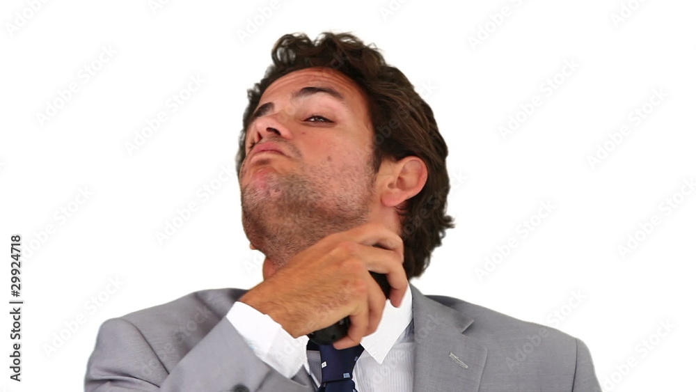 Dark-haired man shaving Dark-haired man shaving
