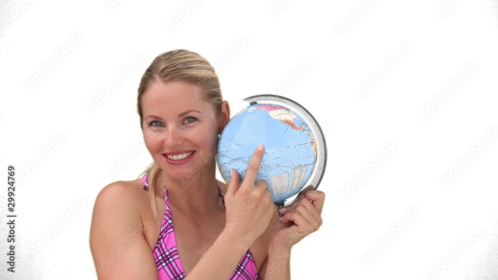 Women in swimsuit chosing a destination of travel Women in swimsuit chosing a destination of travel