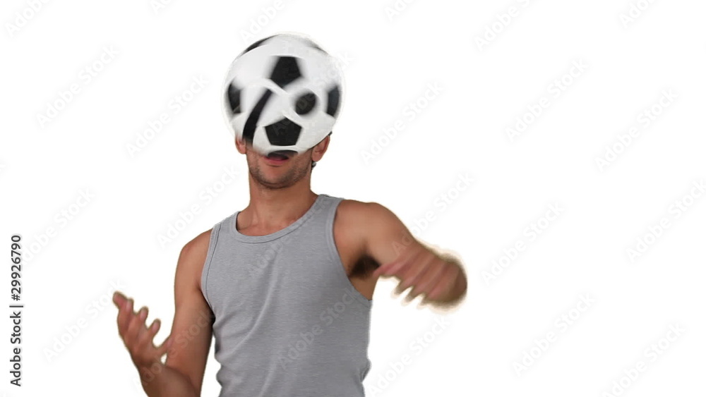 Dark-haired man playing with a soccer ball Dark-haired man playing with a soccer ball